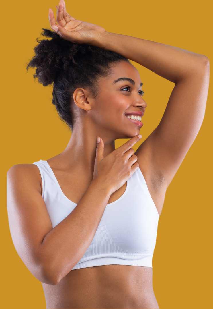 Gradient yellow background of African American Woman with arm raised and smiling